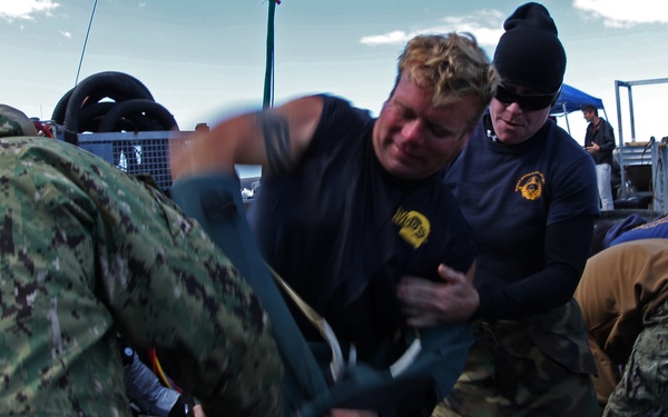 US Navy divers search for the remains of five unaccounted for service members from 1942