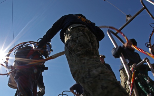US Navy divers search for the remains of five unaccounted for service members from 1942