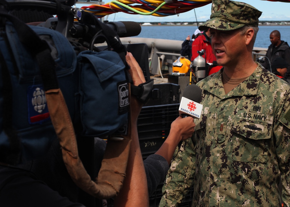 US Navy divers search for the remains of five unaccounted for service members from 1942