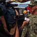 US Navy divers search for the remains of five unaccounted for service members from 1942