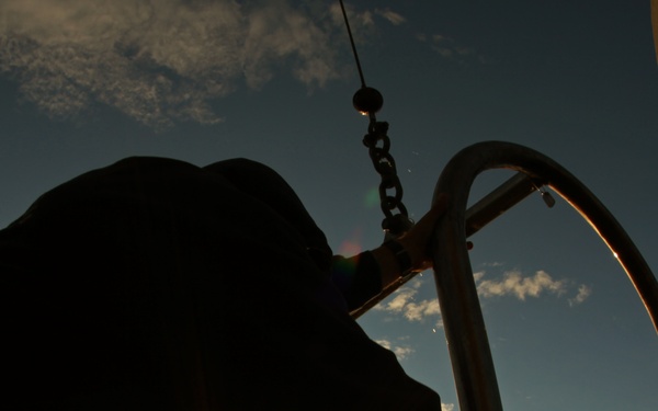US Navy divers search for the remains of five unaccounted for service members from 1942