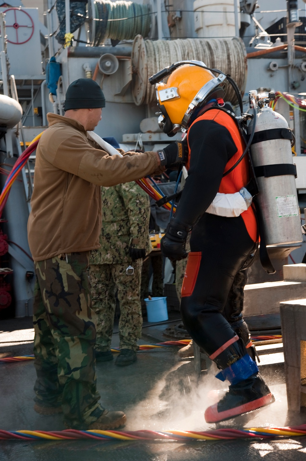 US Navy divers search for the remains of 5 un-accounted for service members from 1942