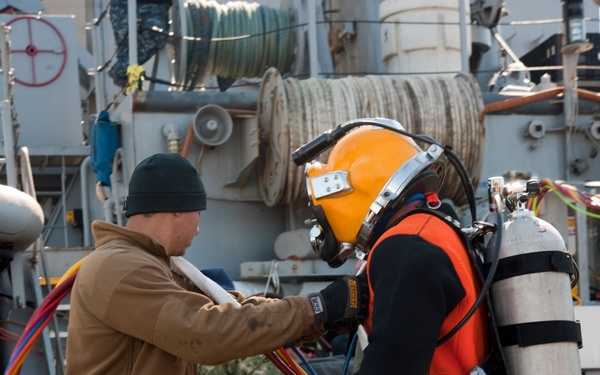 US Navy divers search for the remains of 5 un-accounted for service members from 1942