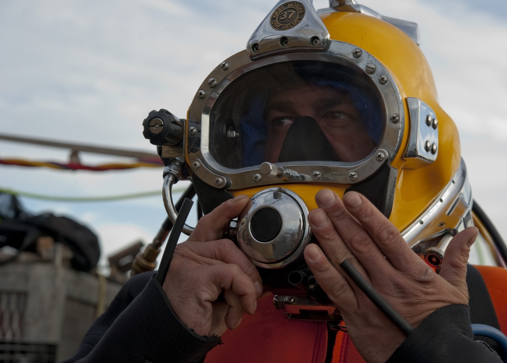 US Navy divers search for the remains of 5 un-accounted for service members from 1942