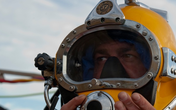 US Navy divers search for the remains of 5 un-accounted for service members from 1942