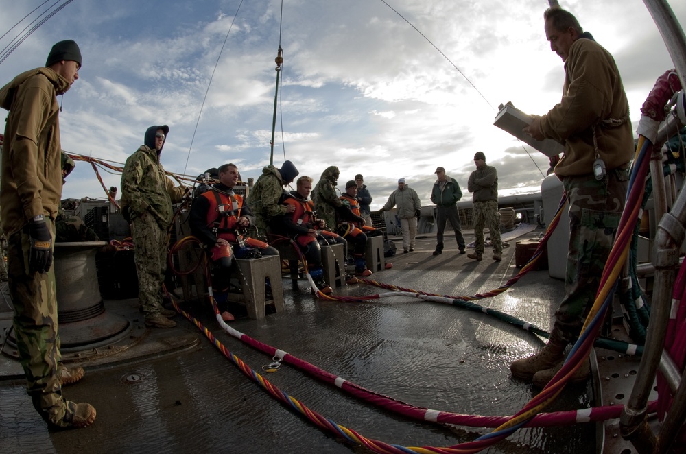 US Navy divers search for the remains of 5 un-accounted for service members from 1942