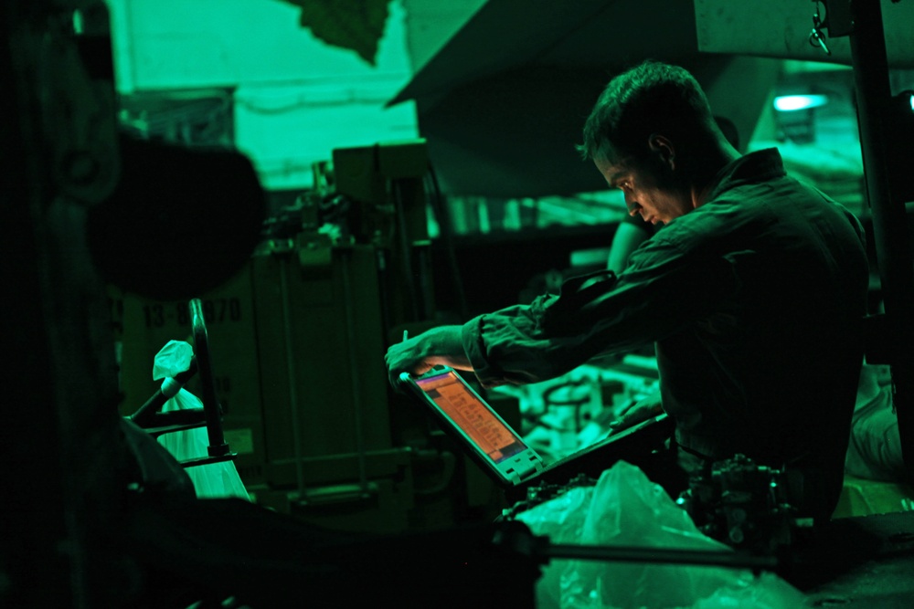 Marines conduct helicopter maintenance