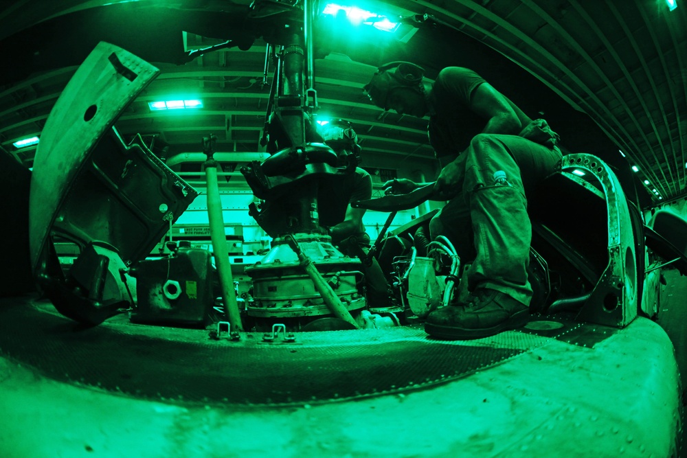 Marines conduct helicopter maintenance
