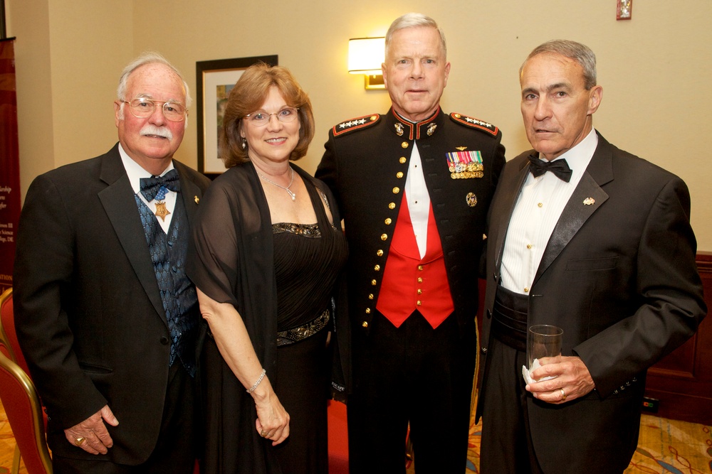 Amos poses for photo at gala