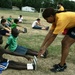 USS Rushmore sailor helps during physical fitness session with kids