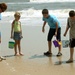 Participants search for shells on the beach