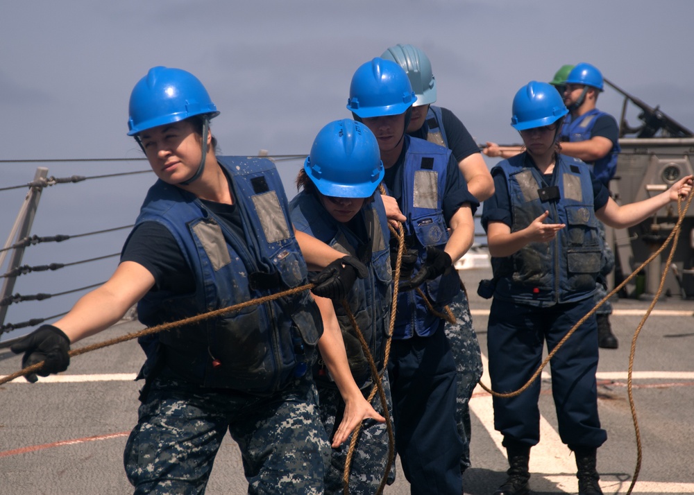 USS James E. Williams sailors heave a line