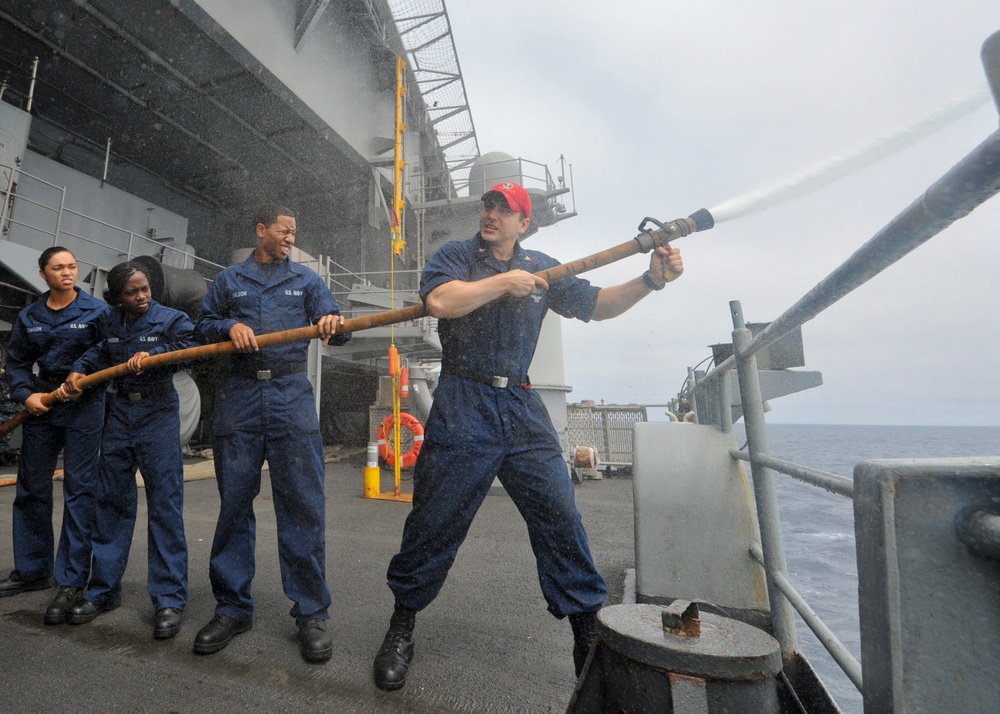 Fire hose familiarization aboard USS Nimitz