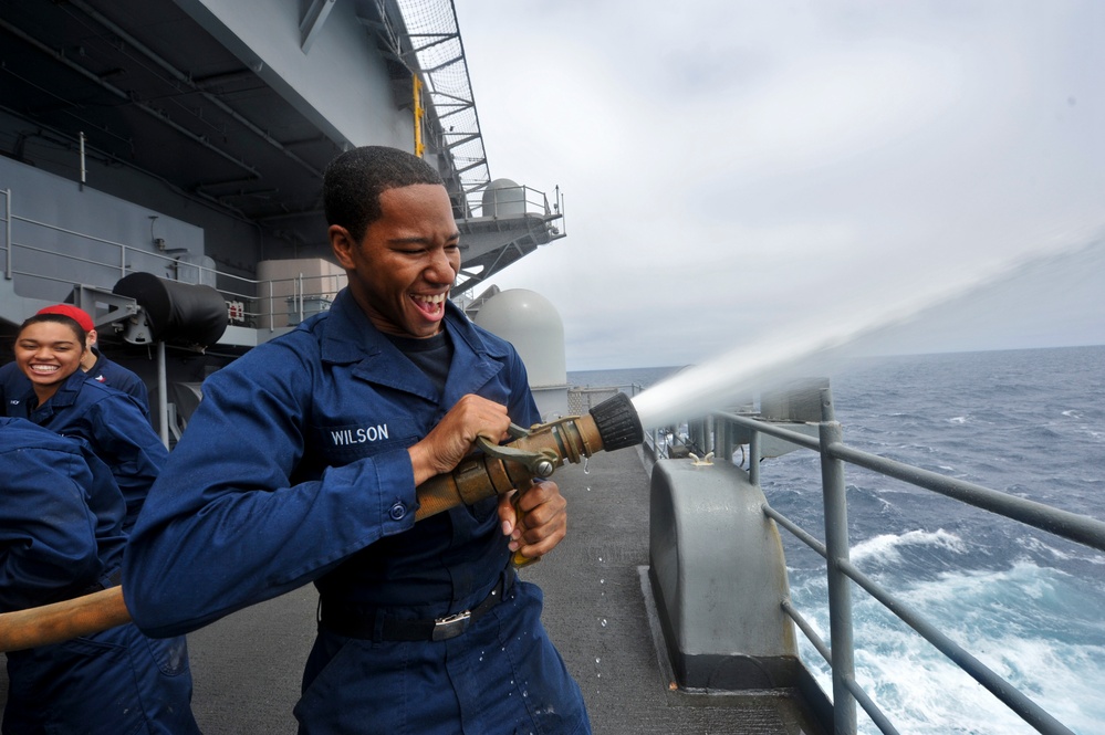 Fire hose familiarization aboard USS Nimitz