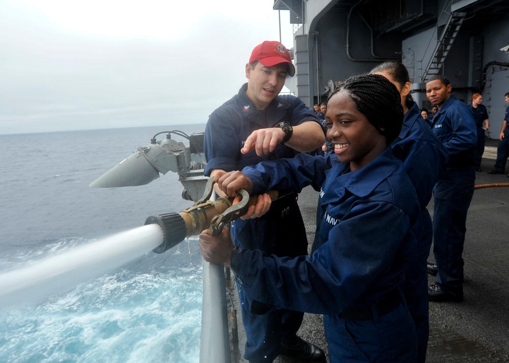 Fire hose familiarization aboard USS Nimitz