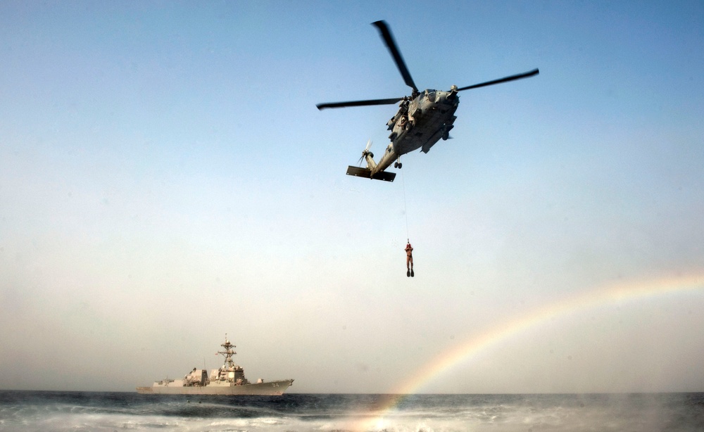 HH-60H Sea Hawk helicopter picks up an explosive ordnance