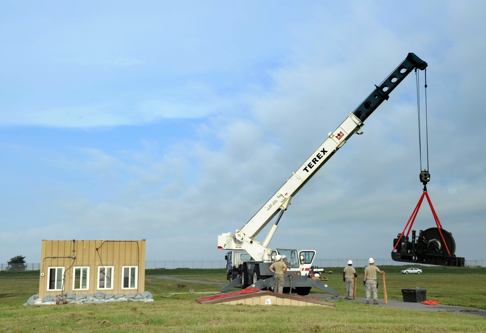 Air Force civil engineers relocate aircraft arresting systems