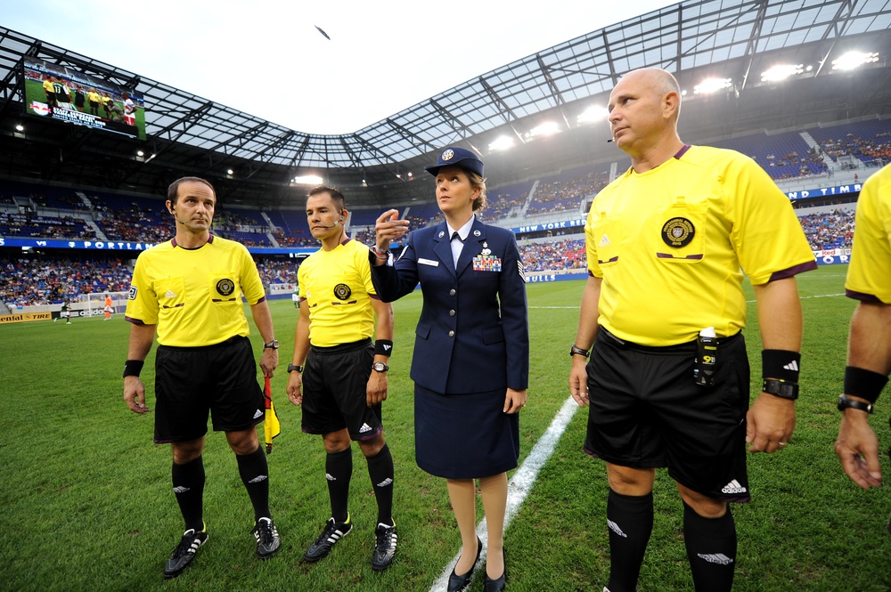 Air Force NCO flips coin before a Major League Soccer match