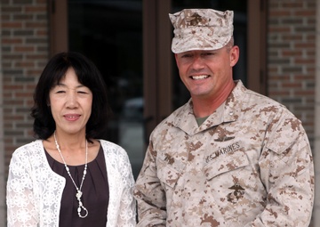 Toshiko Iwasaki and Lt. Col. Nicholas Davis pose for a photo