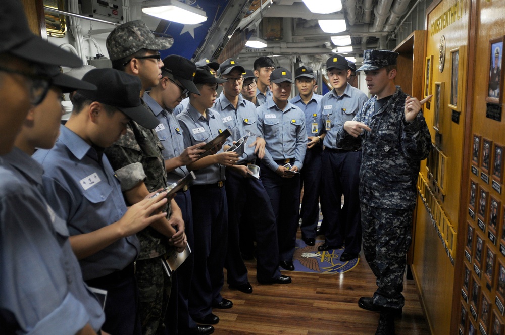 USS Blue Ridge sailors conduct ship tour, onload donuts