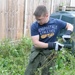 Volunteers help clear garden for local disabled homeowner