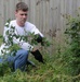 Volunteers help clear garden for local disabled homeowner