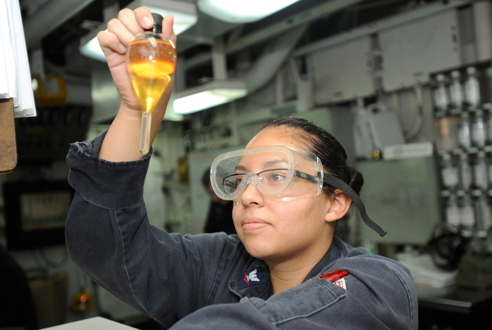 USS Bohomme Richard sailor inspects fuel sample