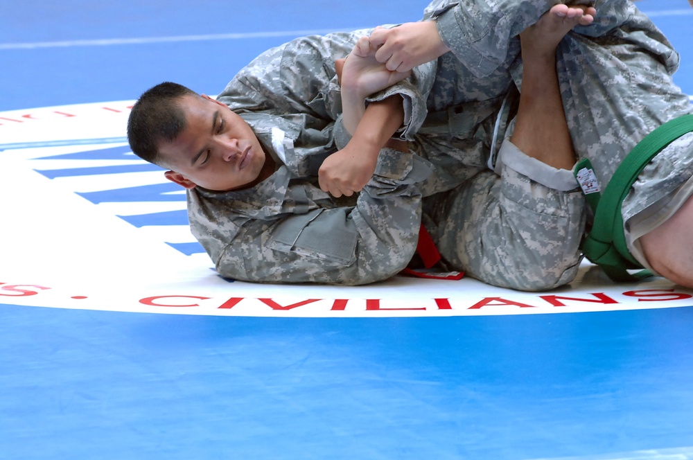 Sgt. 1st Class Jesse Jesse puts a grip on Sgt. Joseph Zamora