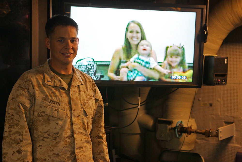 US Marines, sailors connect with families through video teleconference while deployed at sea