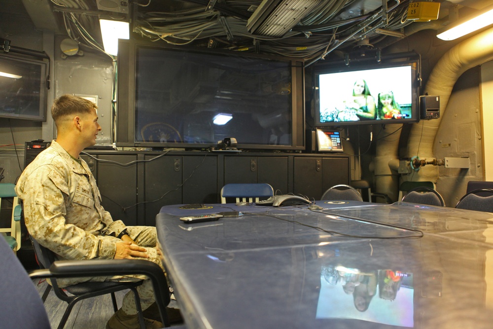 US Marines, sailors connect with families through video teleconference while deployed at sea