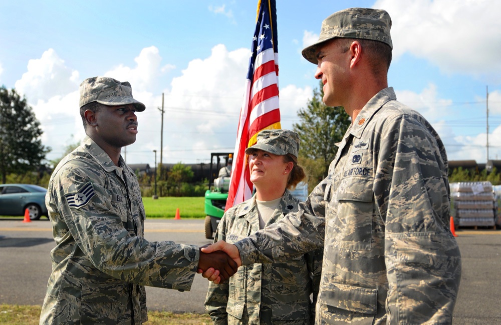 Staff Sgt. Kelvin Isaac re-enlists during the recovery of Hurricane Isaac