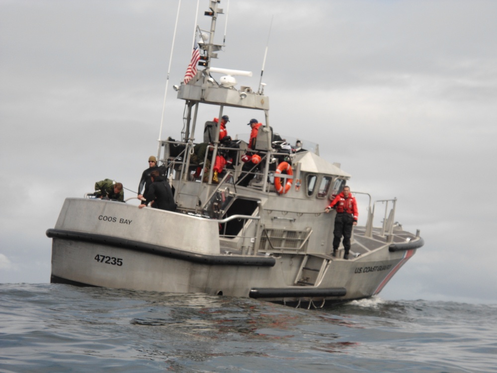 Navy Seabee divers on USCG Motor Life Boat