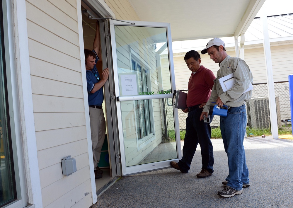 Inspecting the child development center at Naval Air Station New Orleans after Hurricane Isaac