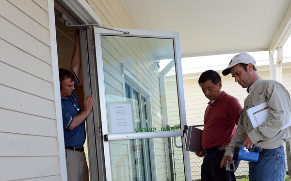 Inspecting the child development center at Naval Air Station New Orleans after Hurricane Isaac
