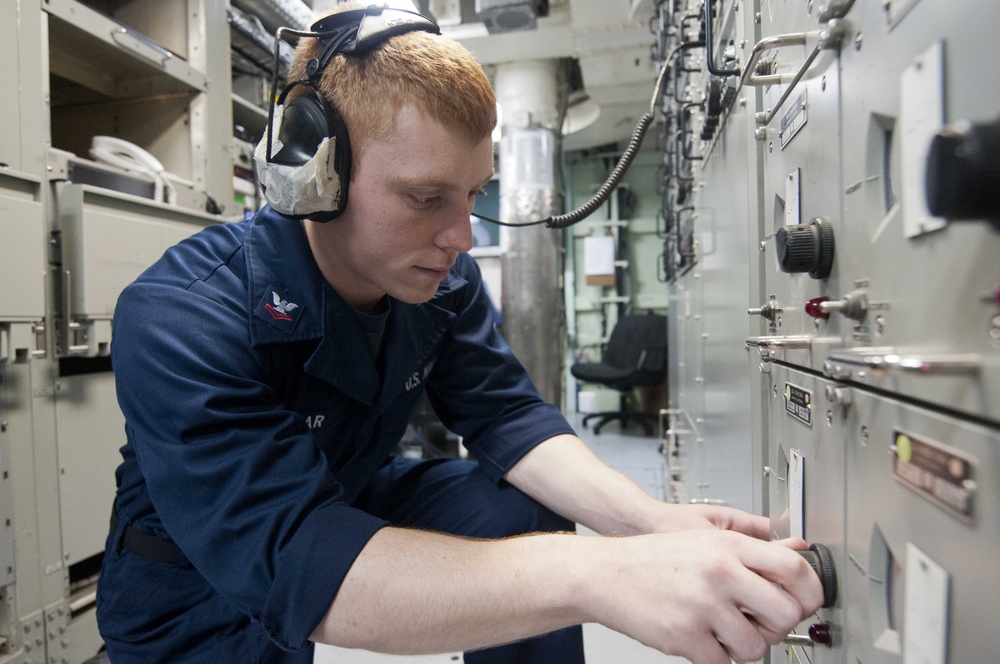 USS Hue City sailor at work