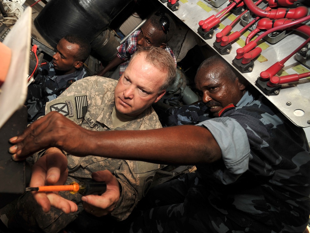 Partnering with US soldiers assists Djiboutian sailors in fixing patrol boats