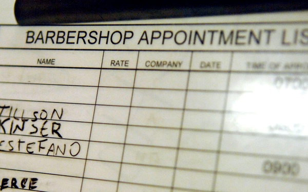The image shows a Barbershop Appointment List on a clipboard or sign-in sheet. Several names are handwritten in the Name column alongside time slots ranging from 0900 to 1200. The list appears to be a military or institutional barbershop scheduling form.