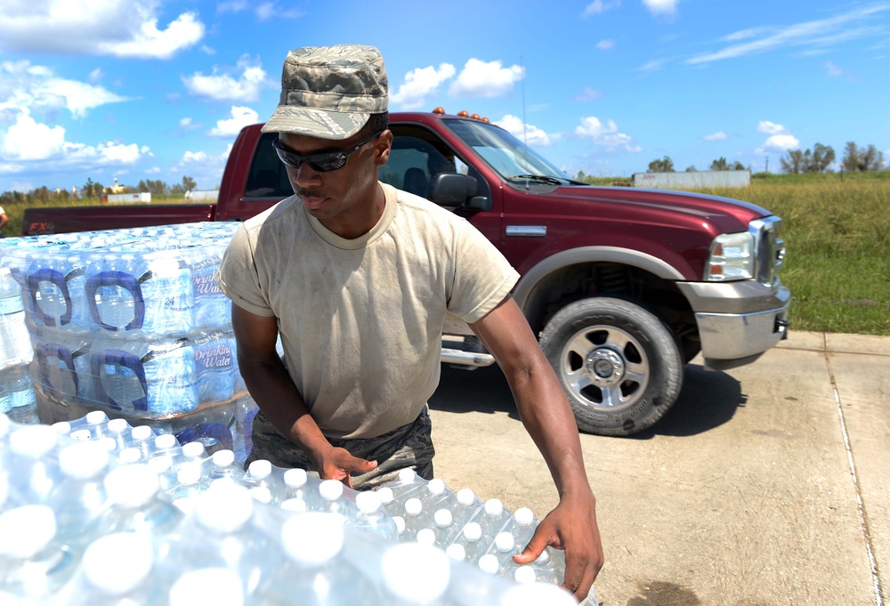 Airman distributes water in Louisiana