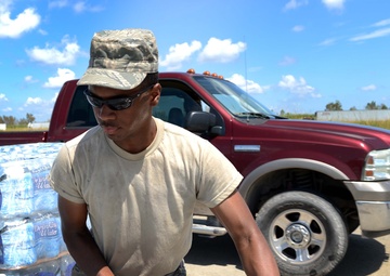 Airman distributes water in Louisiana
