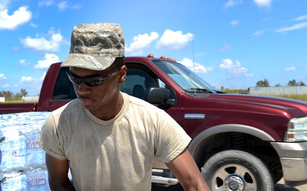 Airman distributes water in Louisiana