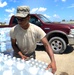 Airman distributes water in Louisiana