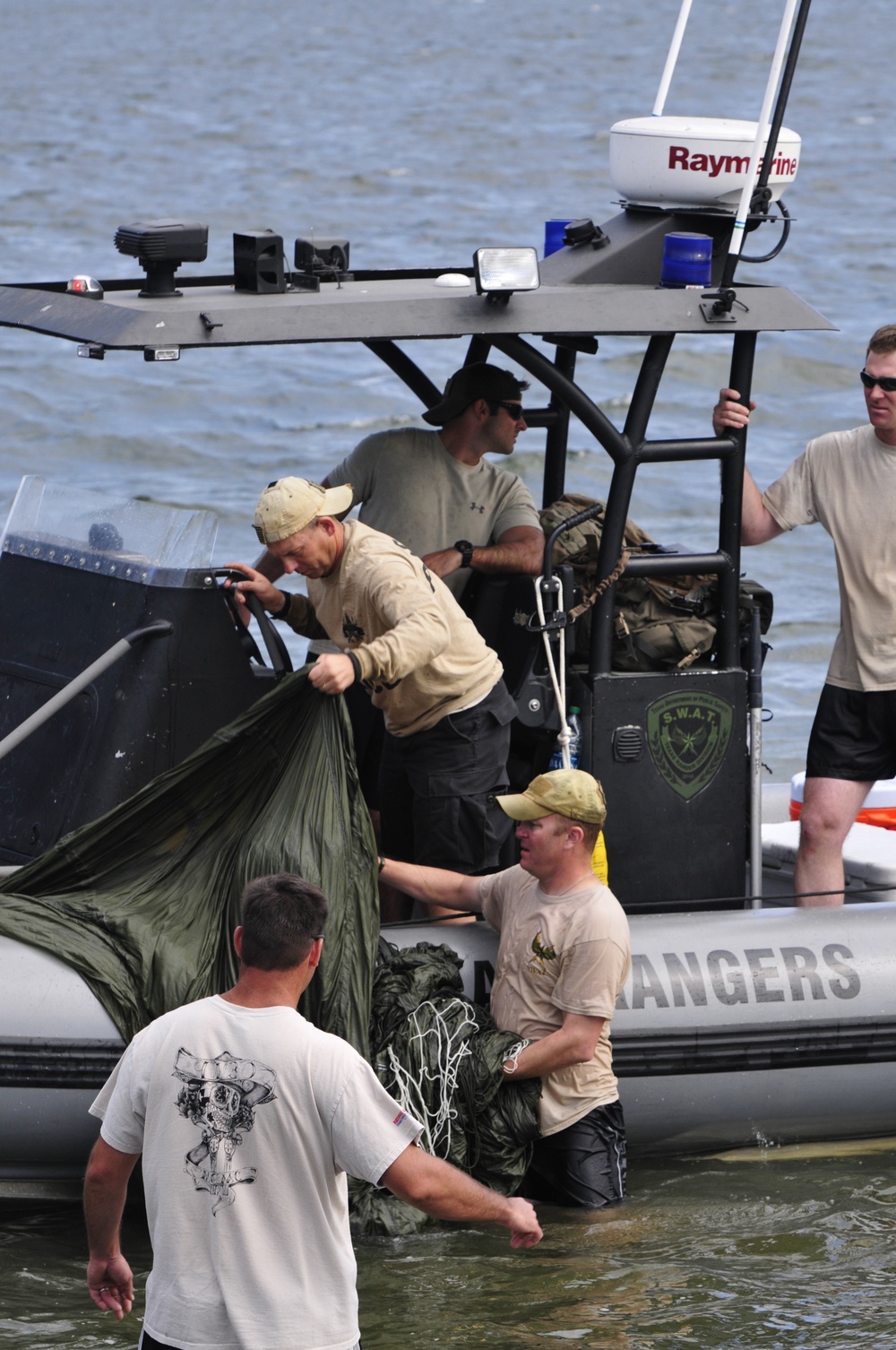 Texas guardsman and other local authorities participate in water jump