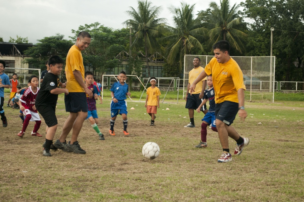 Playing soccer with children in the Philippines