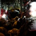 U.S. Navy Seabees fly aboard a C-130 Hercules aircraft