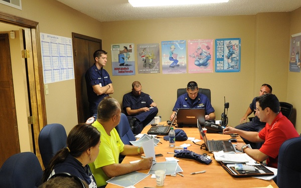 Planning meeting to assess pollution after hurricane
