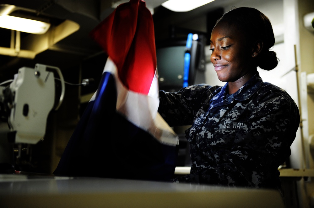 USS Nimitz sailor sews bunting