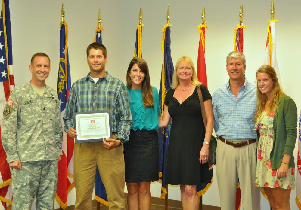 Lt. Col. James A. DeLapp, Nashville District commander honored Curtis Ferguson, civilian with a certificate of appreciation and a gold commander's medallion