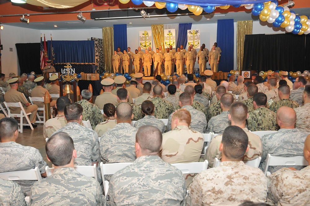 Chief petty officer selectees line up on stage during the chief petty officer’s pinning ceremony at Camp Lemonnier
