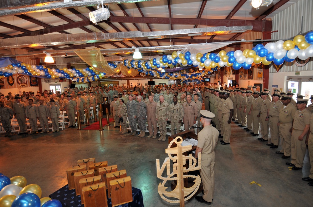 The new chief petty officers recite the 'Marines Hymn' - during the chief petty officer’s pinning ceremony at Camp Lemonnier after having their anchors pinned on their lapels and their new combination covers placed on their heads per Navy tradition