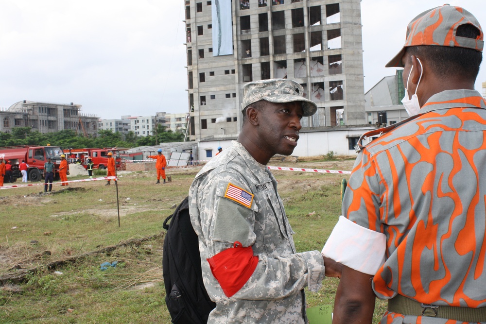 Lt. Col. McFadden speaks with Bangladesh Fire and Civil Defense personnel